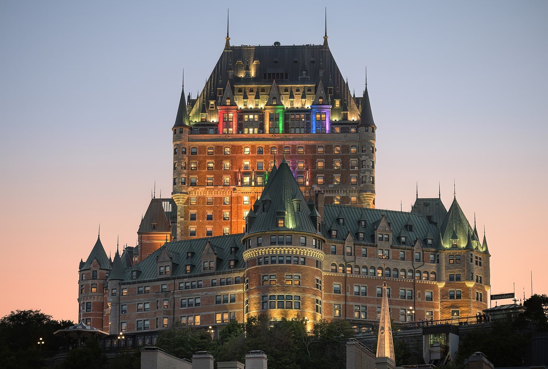 The Château Frontenac lit up above Old Québec at dusk