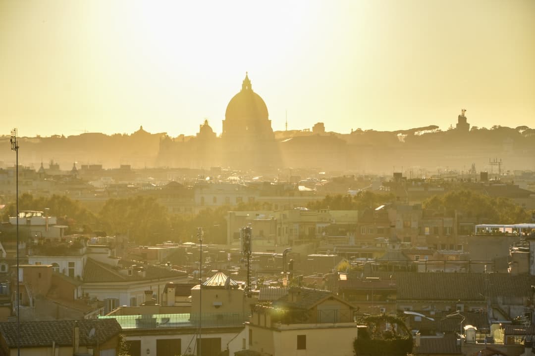 Rome's rooftops stretching toward St Peter's dome