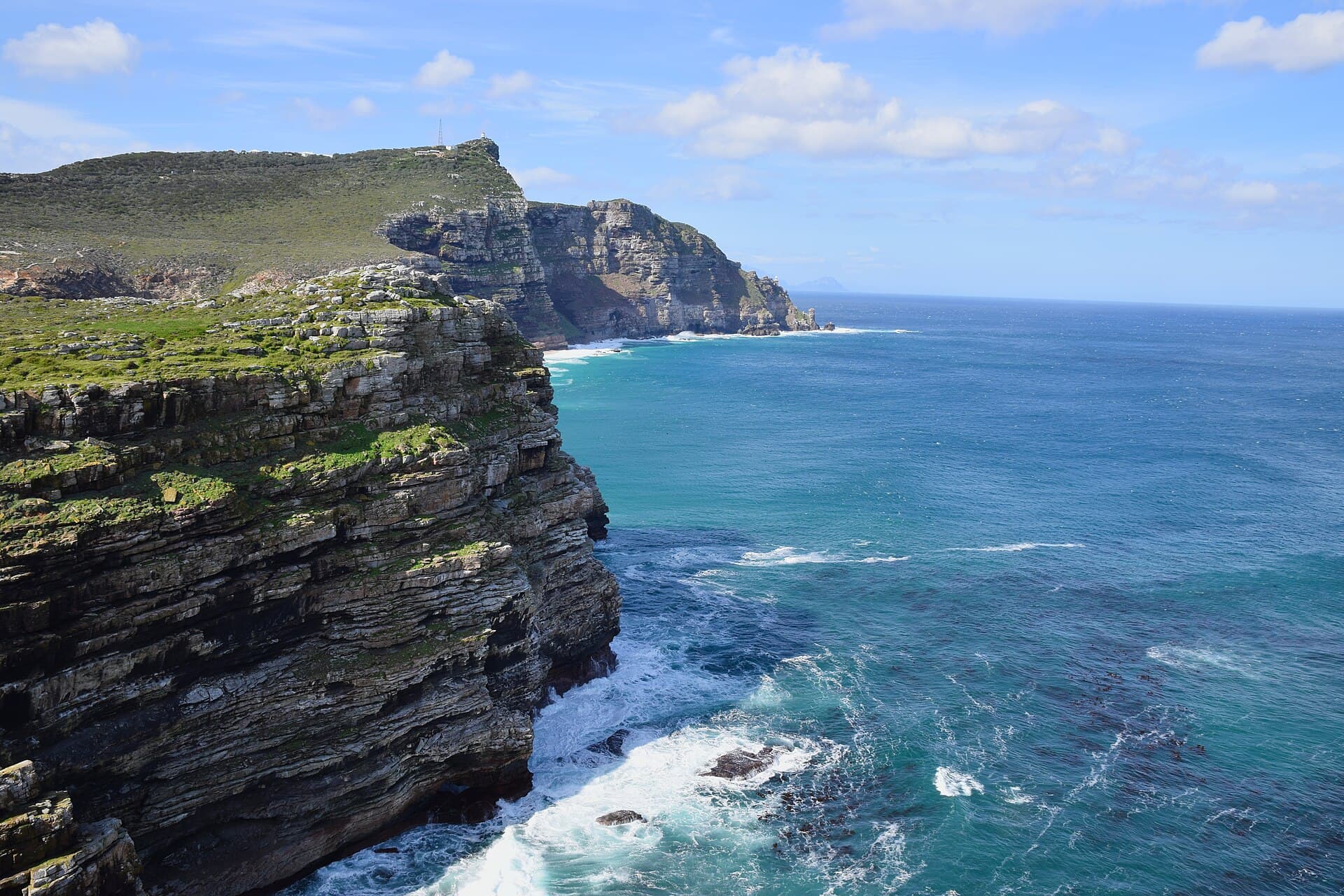 Cape Point's cliffs dropping sheer into the blue