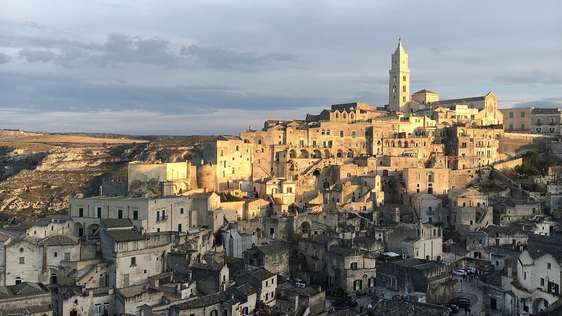 Matera's sassi cave city glowing at golden hour