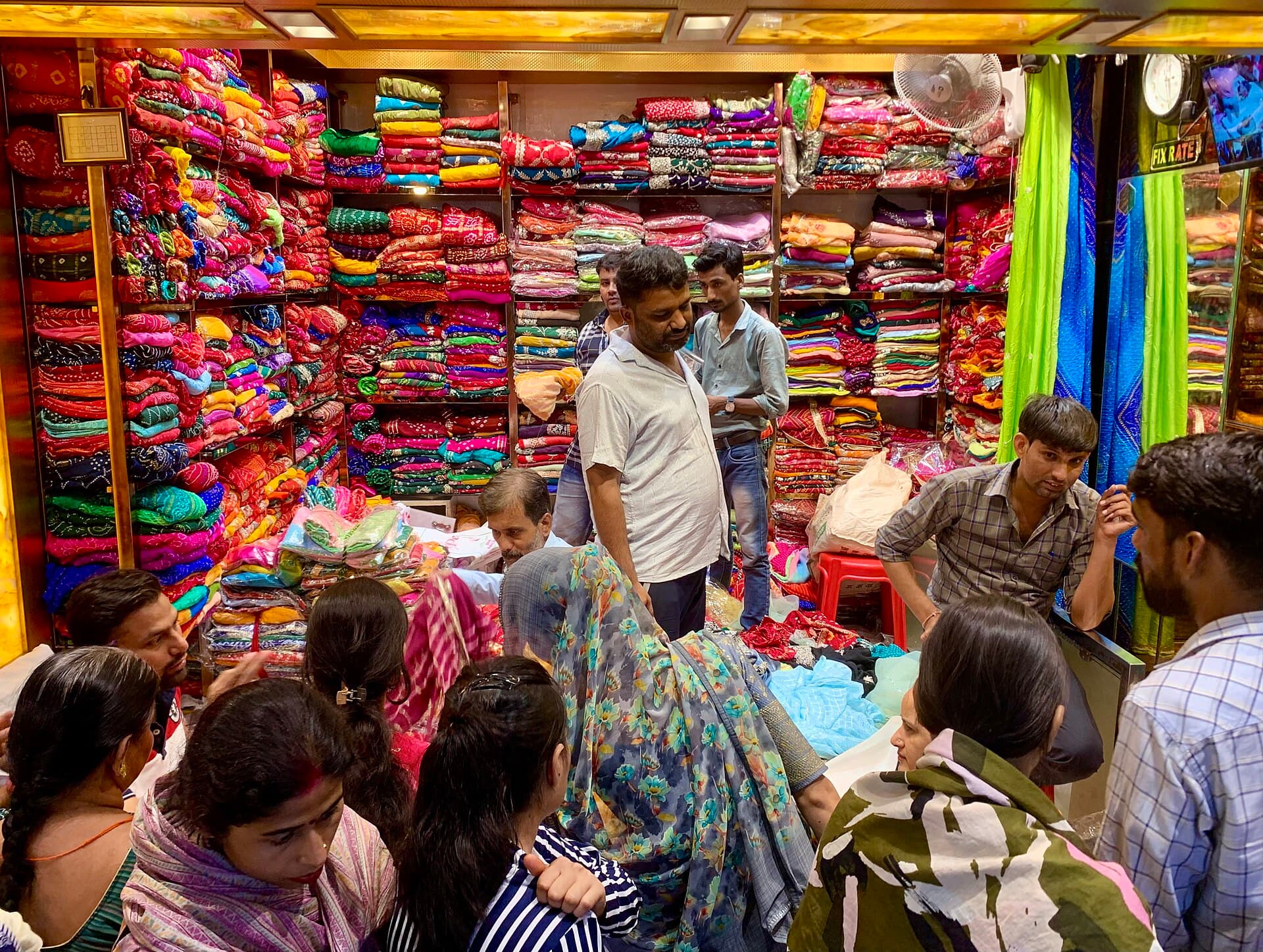 Bolts of dyed fabric stacked in a Rajasthani bazaar