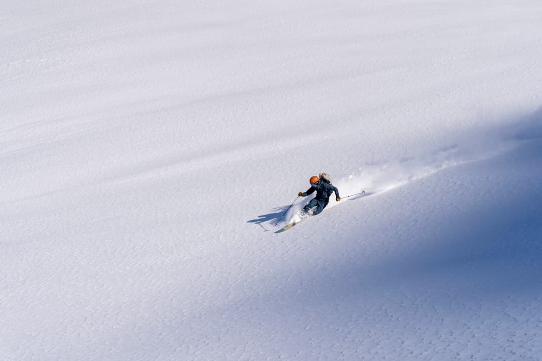 A skier throwing deep Japanese powder