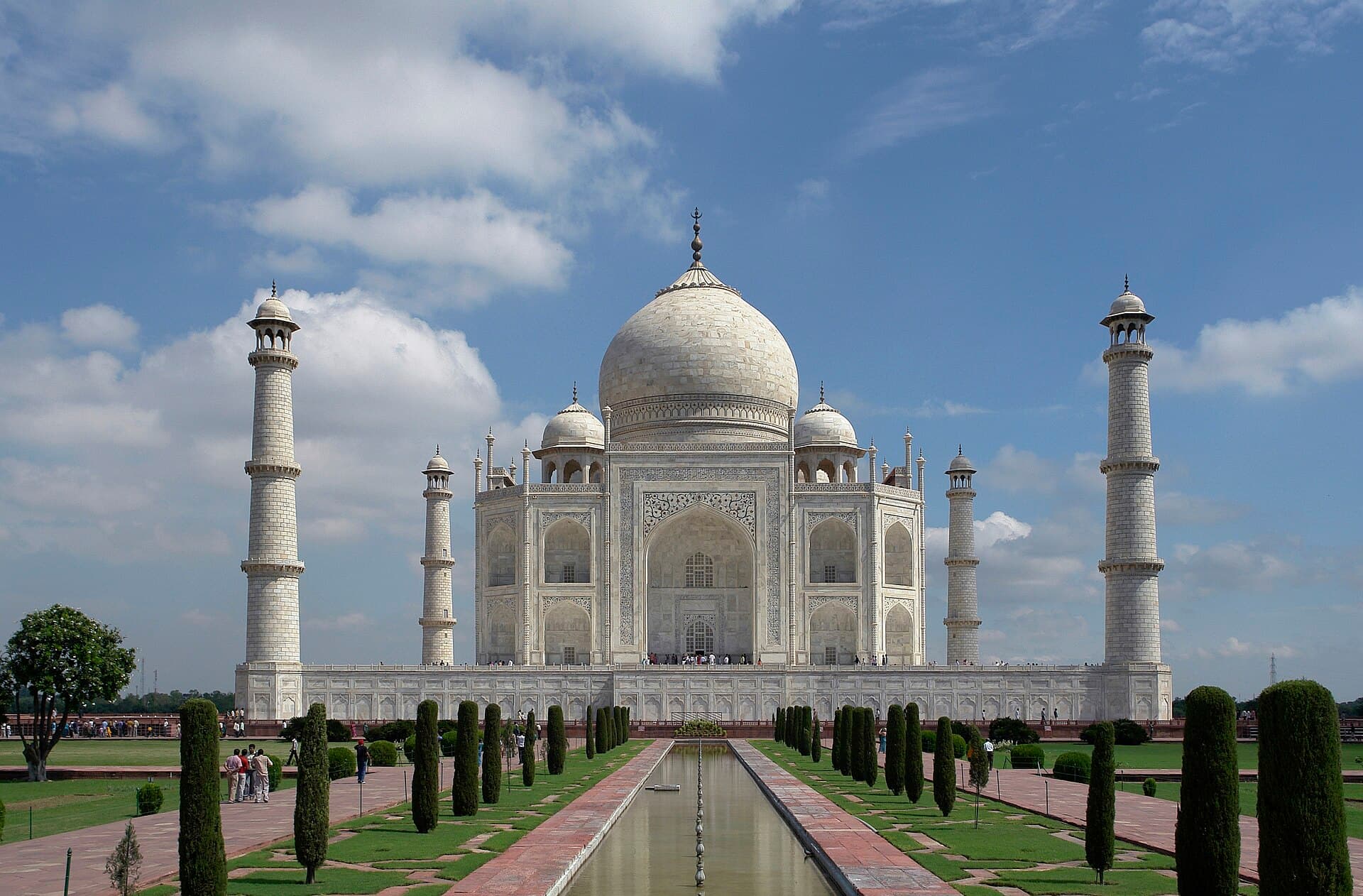 The Taj Mahal reflected in its long pool at dawn