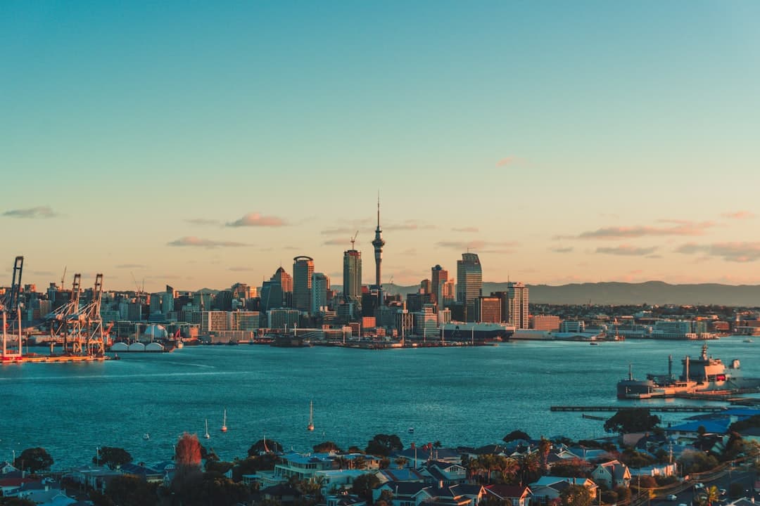 Auckland's Sky Tower and harbour skyline at dusk
